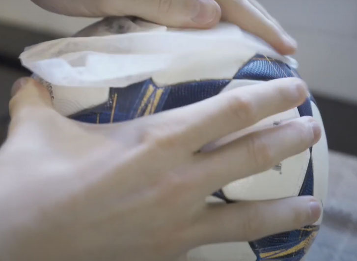 drying the ball with a dry cloth